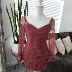 Mini bodycon long sleeve dress mauve. Sleeves are sheer.